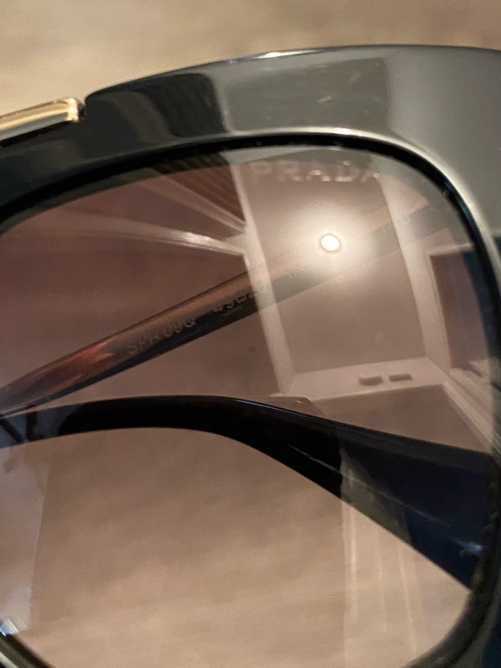 Prada Black Frame Cat-Eye Sunglasses with Gold Bridge - Picture 5 of 7